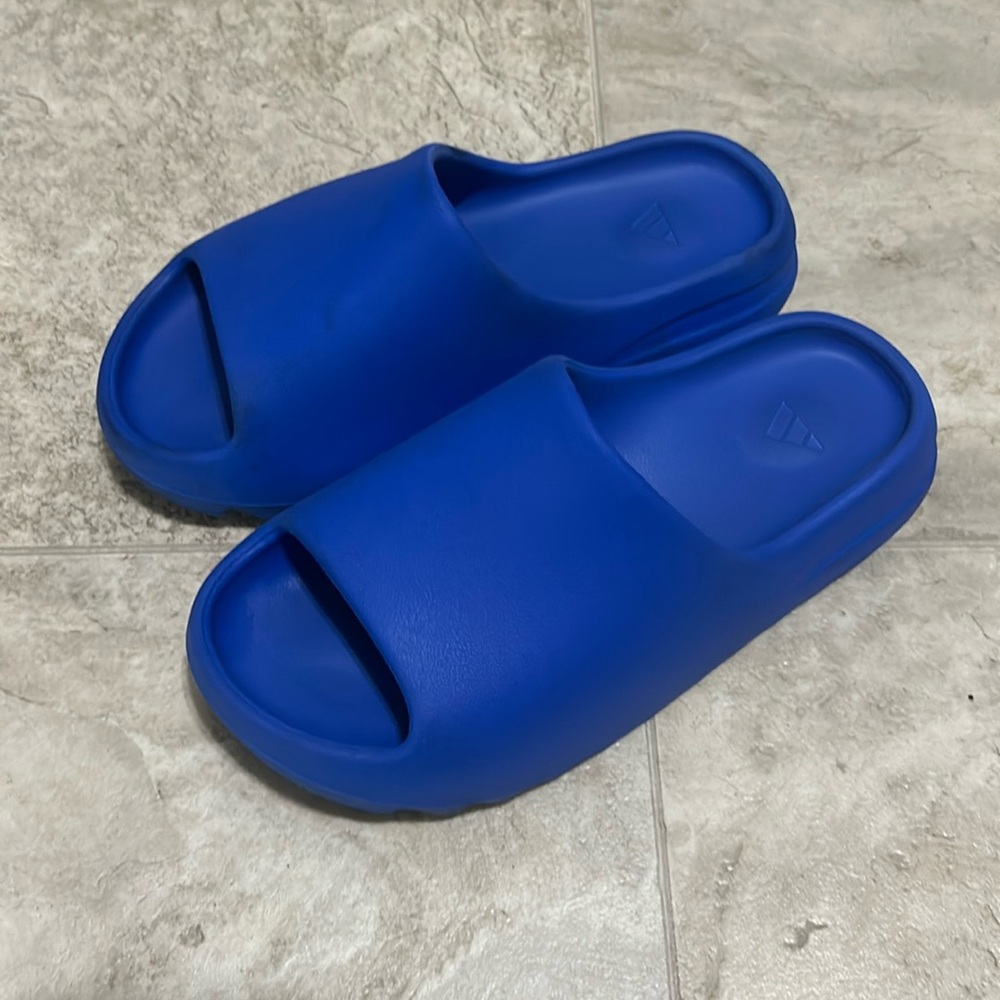New Blue Yeezy slides, size 8, and negotiable price.